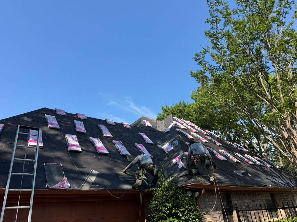 the roof of a house with a bird perched on top of it